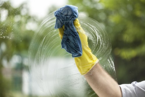 Local window cleaner working on a residential building in N7