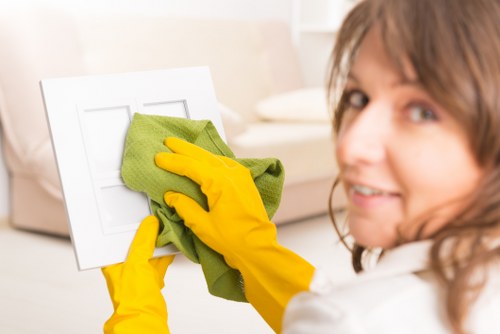 Local cleaner preparing a kitchen and worktops in an N7 property
